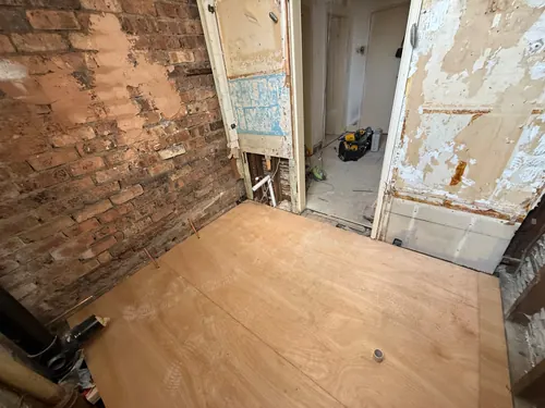 Ply floor laid with copper pipe stubs left up for the new suite