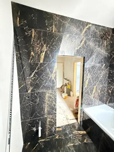 Tiled wall and reveal around the bathroom doorway